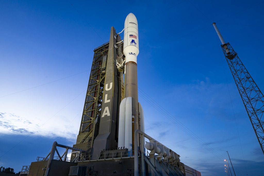 Image of a ULA rocket with Amazon logo as a last minute issue grounds sending the latest batch of Project Kuiper internet satellites into orbit.