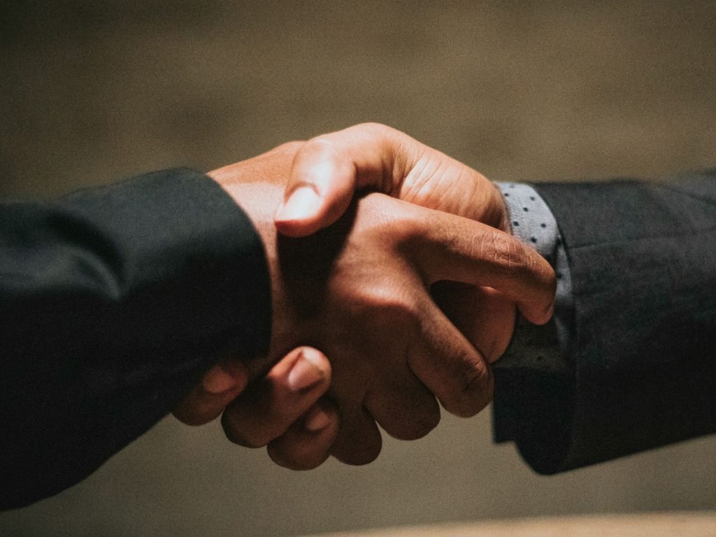 Handshake as AT&T has closed a $23 billion acquisition of EchoStar wireless spectrum, adding mid-band and low-band capacity across the US.
