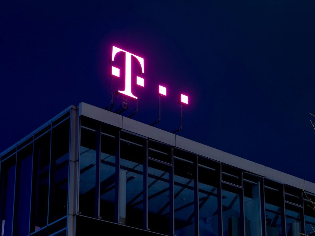 Company logo on a building as Deutsche Telekom deploys ChatGPT Enterprise to build AI-native telco operations across customer care and its core networks.