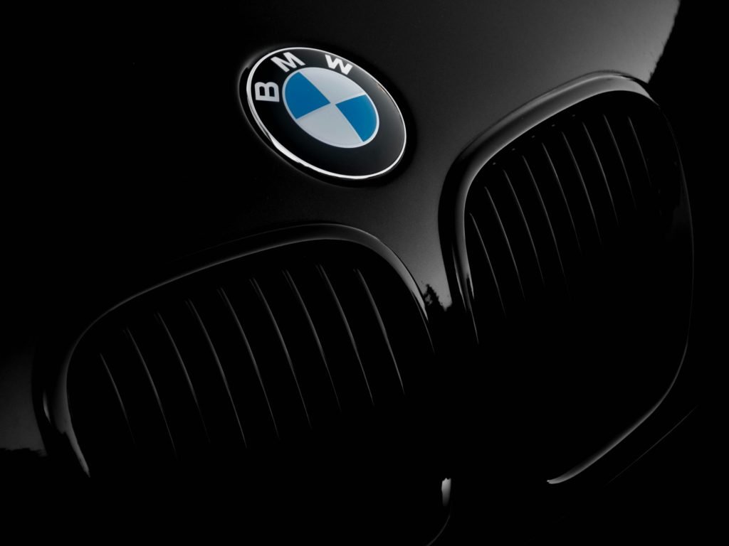 Brand logo on a vehicle as Viasat has demonstrated the first automotive satellite voice call fully integrated into a BMW Group vehicle platform, a milestone for connected car communications outside cellular range.